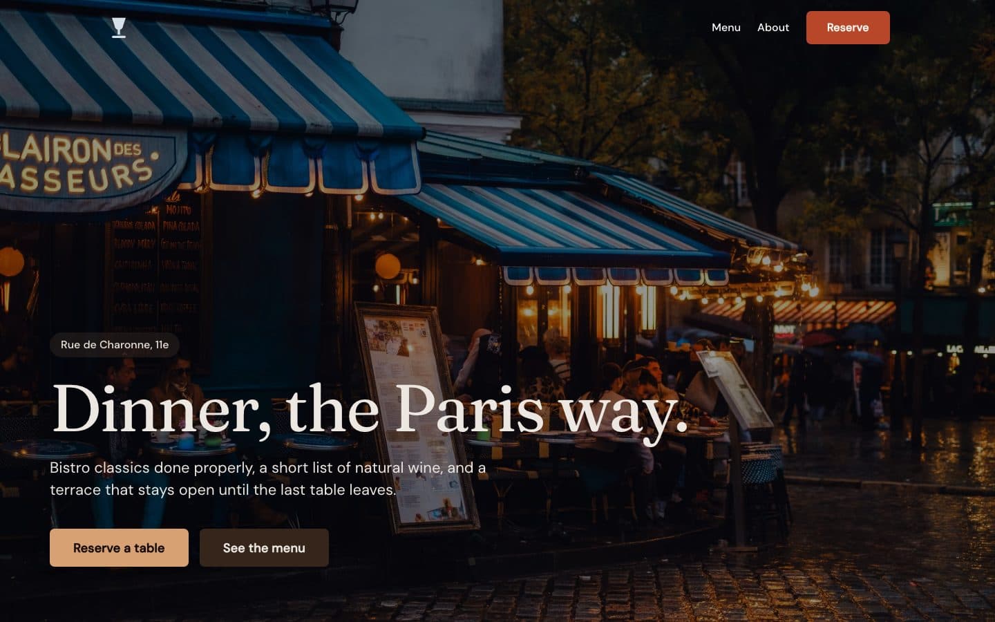 Odette, a Paris bistro site — evening terrace photo behind the headline Dinner, the Paris way